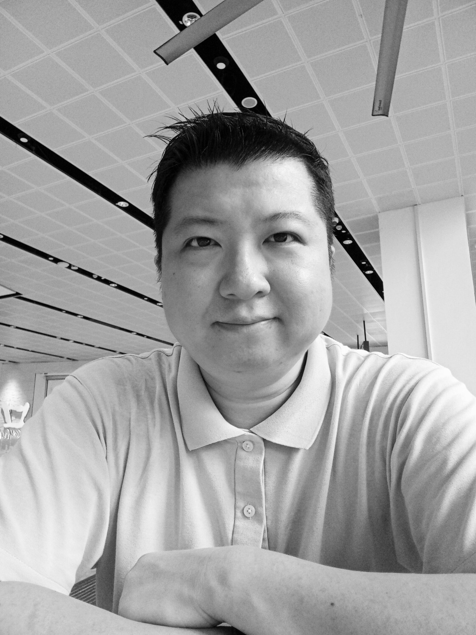 A recent selfie photo (in black and white).